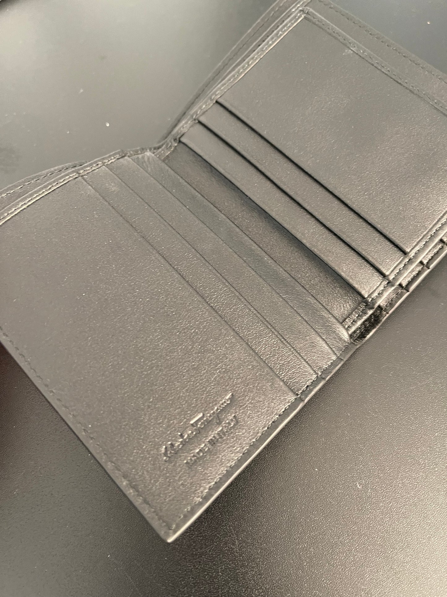 Pre-Owned Salvatorre Ferramgamo Men's Black Textured Bifold Wallet